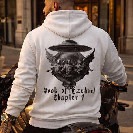 Person wearing a white hoodie with a graphic design and text, sitting on a motorcycle in front of a casino.
