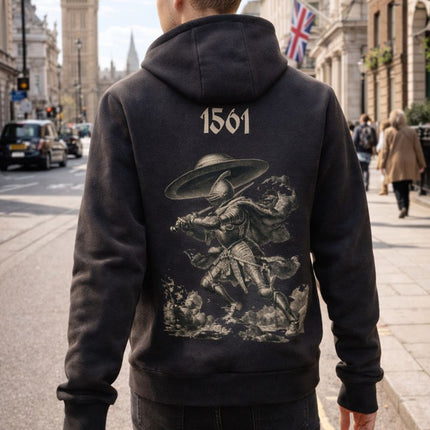 Person wearing a black hoodie with a graphic UFO design and '1561' on the back, standing in a city street.
