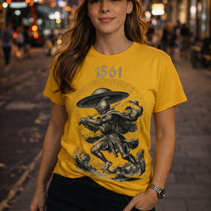 Woman wearing a yellow t-shirt with graphic design and a cap on a city street at night.