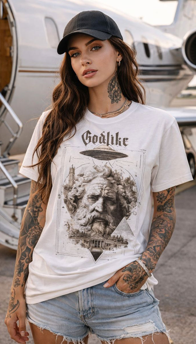 Woman wearing a white t-shirt with a graphic design in front of a private jet.