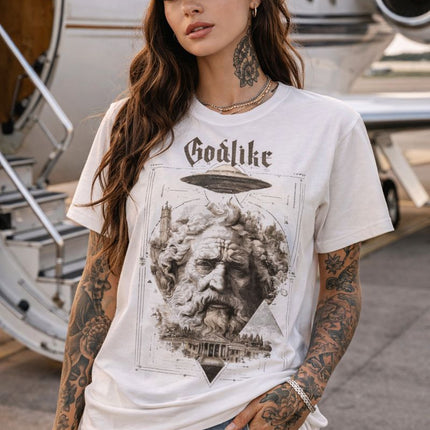 Woman wearing a white t-shirt with a graphic design in front of a private jet.