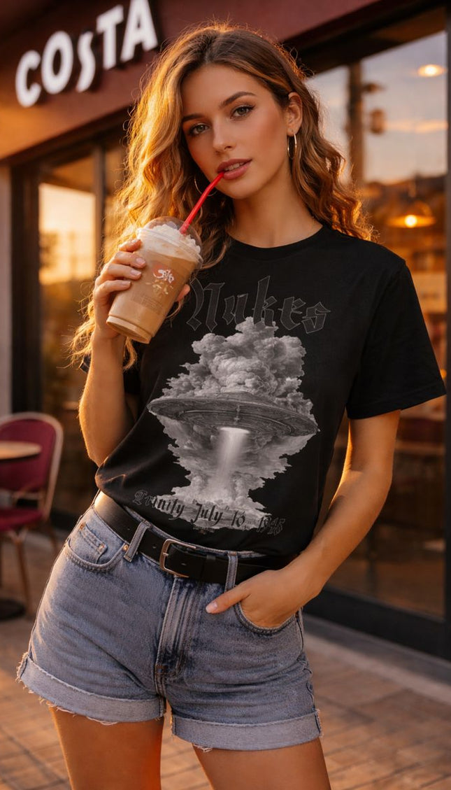 Woman holding a iced coffee in front of a Costa Coffee shop