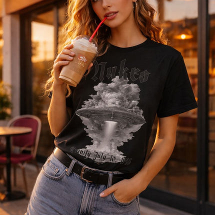 Woman holding a iced coffee in front of a Costa Coffee shop